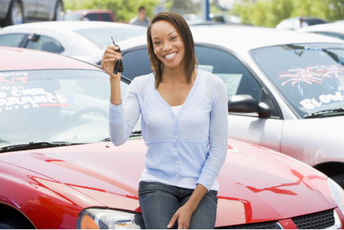 Woman holding keys to her new car that she purchased with a loan from Pilot Grove Savings Bank