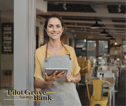 A small business owner checks her business checking account from Pilot Grove Savings Bank.